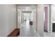 Hallway with tile flooring and neutral walls, offering a glimpse into other living spaces at 31400 N 130Th Ave, Peoria, AZ 85383