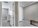 Hallway with neutral colors and a storage bench at 31400 N 130Th Ave, Peoria, AZ 85383