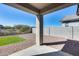 Covered patio with concrete slab, pavers, and a view of the outdoor living area at 31400 N 130Th Ave, Peoria, AZ 85383