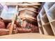 Attic space provides ample storage with insulation and built-in shelving at 3238 E Ashurst Dr, Phoenix, AZ 85048