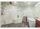 Modern bathroom featuring a marble walk-in shower, gray tile, and a soaking tub at 3238 E Ashurst Dr, Phoenix, AZ 85048