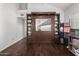 Bedroom featuring hardwood floors, a large built-in wardrobe and shelving, and neutral walls at 3238 E Ashurst Dr, Phoenix, AZ 85048