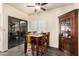 Charming dining area featuring a table with seating for four, next to sliding glass doors at 3238 E Ashurst Dr, Phoenix, AZ 85048