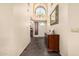 Bright entryway with tile floors, a chandelier, and a decorative mirror at 3238 E Ashurst Dr, Phoenix, AZ 85048