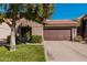 Home featuring desert landscaping, a tile roof, and an attached two-car garage at 3238 E Ashurst Dr, Phoenix, AZ 85048