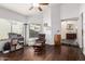 Inviting living room featuring hardwood floors, a ceiling fan, and neutral walls at 3238 E Ashurst Dr, Phoenix, AZ 85048