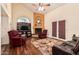 Inviting living room with hardwood floors, fireplace, ceiling fan, and comfortable seating at 3238 E Ashurst Dr, Phoenix, AZ 85048