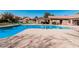 A bright blue community pool with lounge seating around the pool deck at 3238 E Ashurst Dr, Phoenix, AZ 85048