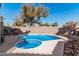 Private backyard featuring a refreshing pool and spa with rock landscaping at 3238 E Ashurst Dr, Phoenix, AZ 85048