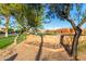 Irene de Los Lagos Elementary School sign amid trees and a brick building at 3238 E Ashurst Dr, Phoenix, AZ 85048