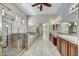 Bright bathroom features a glass shower, soaking tub, and double sink vanity at 34014 N 43Rd St, Cave Creek, AZ 85331