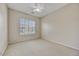 Cozy bedroom with plush carpeting and a bright window with plantation shutters at 34014 N 43Rd St, Cave Creek, AZ 85331