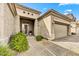 Inviting home with covered entry, beautiful landscaping, and an attached two-car garage at 34014 N 43Rd St, Cave Creek, AZ 85331