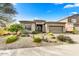 Charming single-story home with desert landscaping, a two-car garage, and a well-maintained yard at 34014 N 43Rd St, Cave Creek, AZ 85331