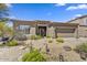 Charming home featuring low-maintenance desert landscaping, with rock and decorative elements at 34014 N 43Rd St, Cave Creek, AZ 85331