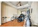 The home gym boasts tile floors, mirrored walls, an elliptical machine, and a weight machine at 34014 N 43Rd St, Cave Creek, AZ 85331