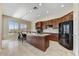 Spacious kitchen with granite countertops, island with seating, and stainless-steel appliances at 34014 N 43Rd St, Cave Creek, AZ 85331