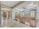 Spacious living room features hardwood floors, plantation shutters, and mirrors accent wall at 34014 N 43Rd St, Cave Creek, AZ 85331