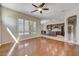 Open-concept living space with hardwood floors, connecting kitchen and other living areas at 34014 N 43Rd St, Cave Creek, AZ 85331