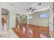 Open living room showcasing hardwood floors, plantation shutters, and abundant natural light at 34014 N 43Rd St, Cave Creek, AZ 85331
