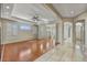 Bright open living room with hardwood floors, tray ceilings, ceiling fan, and lots of natural light at 34014 N 43Rd St, Cave Creek, AZ 85331