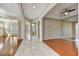 Open-concept area has hardwood floors, tray ceilings, and archways leading to adjacent rooms at 34014 N 43Rd St, Cave Creek, AZ 85331