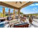 Cozy covered patio featuring comfortable seating and a view of the desert landscape at 34014 N 43Rd St, Cave Creek, AZ 85331