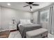 Bright bedroom with a ceiling fan, neutral colors, and comfortable furnishings at 3503 E Campo Bello Dr, Phoenix, AZ 85032