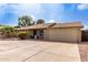 Charming single-story home featuring a well-maintained yard, large driveway, and a two-car garage at 3503 E Campo Bello Dr, Phoenix, AZ 85032