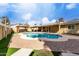 Inviting backyard with a sparkling pool and a covered patio with a seating area at 3503 E Campo Bello Dr, Phoenix, AZ 85032