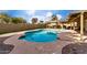 Backyard pool with artificial turf and a pergola in a fenced yard at 3503 E Campo Bello Dr, Phoenix, AZ 85032