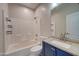 Well-lit bathroom with a tub and shower, and modern fixtures at 3929 E Flintlock Dr, Queen Creek, AZ 85142