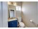 Contemporary half bathroom features blue vanity and modern fixtures at 3929 E Flintlock Dr, Queen Creek, AZ 85142