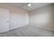 Neutral bedroom with a ceiling fan, plush carpet, and ample light at 3929 E Flintlock Dr, Queen Creek, AZ 85142