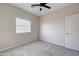 Bedroom featuring plush carpeting, a ceiling fan, and natural light at 3929 E Flintlock Dr, Queen Creek, AZ 85142