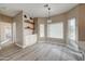 Bright breakfast nook with white cabinets, wooden shelves, and many windows at 3929 E Flintlock Dr, Queen Creek, AZ 85142