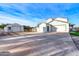 View of the garages and other outbuildings at 3929 E Flintlock Dr, Queen Creek, AZ 85142