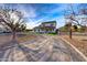 Beautiful front yard with circular driveway leading to a charming two-story home at 3929 E Flintlock Dr, Queen Creek, AZ 85142