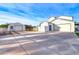 Exterior of the home showcasing the garages and other outbuildings at 3929 E Flintlock Dr, Queen Creek, AZ 85142