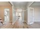 Inviting foyer with light-colored flooring and views into adjacent rooms with modern decor at 3929 E Flintlock Dr, Queen Creek, AZ 85142