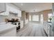 Bright kitchen with stainless steel appliances, white cabinets, and breakfast nook at 3929 E Flintlock Dr, Queen Creek, AZ 85142