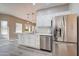 Modern kitchen featuring stainless steel refrigerator and large island with sink at 3929 E Flintlock Dr, Queen Creek, AZ 85142