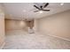 Carpeted living room with neutral walls, ceiling fan, and recessed lighting at 3929 E Flintlock Dr, Queen Creek, AZ 85142