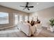 Relaxing living room with modern ceiling fan and neutral color palette at 3929 E Flintlock Dr, Queen Creek, AZ 85142