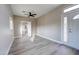 Spacious living room with ceiling fan and a bright double front door at 3929 E Flintlock Dr, Queen Creek, AZ 85142