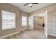 Office with windows and light-colored walls, features glass paneled double doors to dining area at 3929 E Flintlock Dr, Queen Creek, AZ 85142