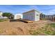 Backyard shed featuring a small porch, providing extra storage and functionality to the home at 3929 E Flintlock Dr, Queen Creek, AZ 85142