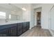 Modern bathroom features dual sinks, dark cabinets and a glass-enclosed shower at 3951 E Gold Mountain Ave, San Tan Valley, AZ 85143