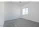 Bright bedroom features neutral carpet, white walls, and a window that provides natural light at 3951 E Gold Mountain Ave, San Tan Valley, AZ 85143