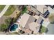 Aerial view of a backyard with a pool, hot tub, and artificial grass area at 4019 W Valley View Dr, Laveen, AZ 85339